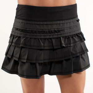 ISO: RUN BACK ON TRACK SKIRT SZ 2 IN BLACK